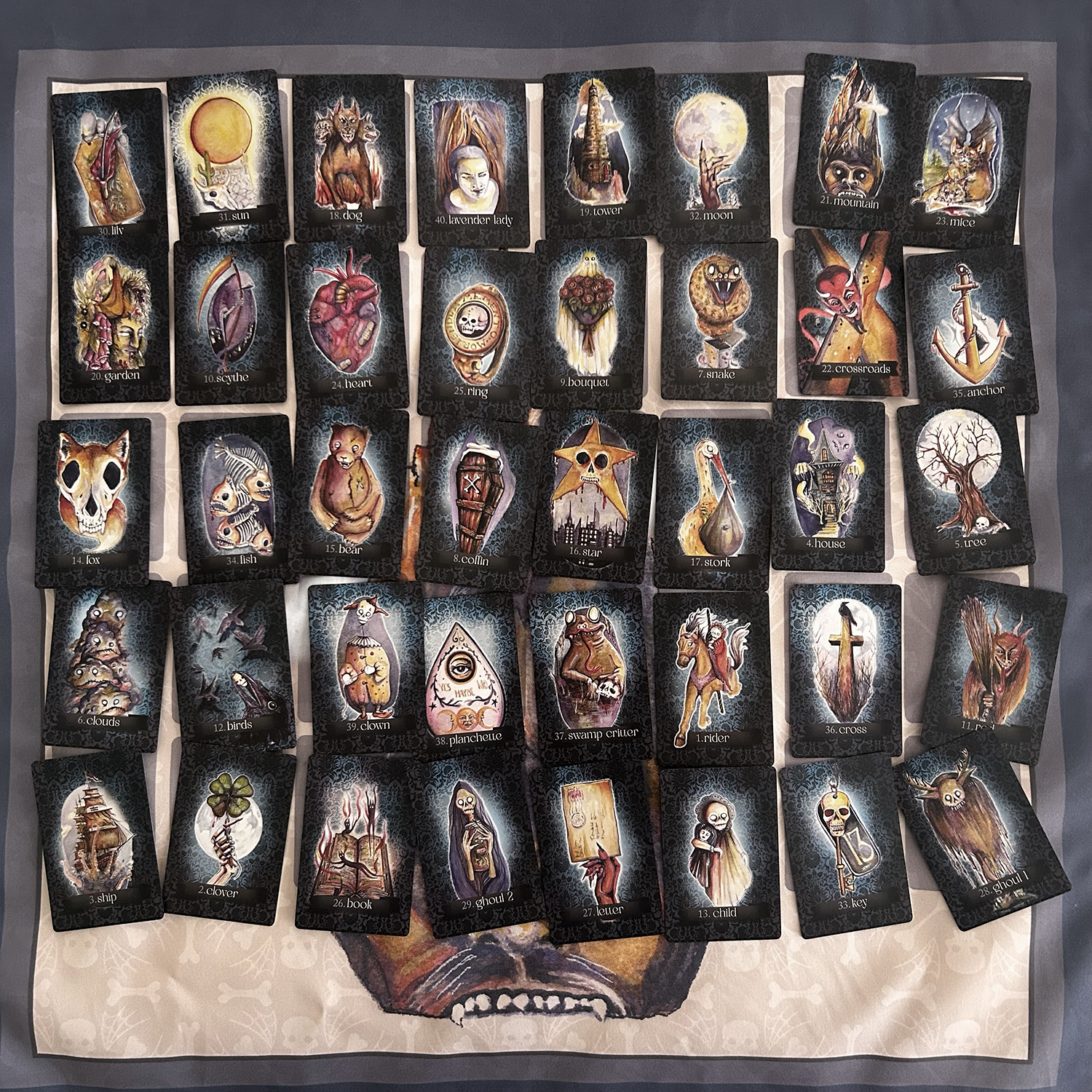 Collection of tarot cards with intricate designs on a textured surface