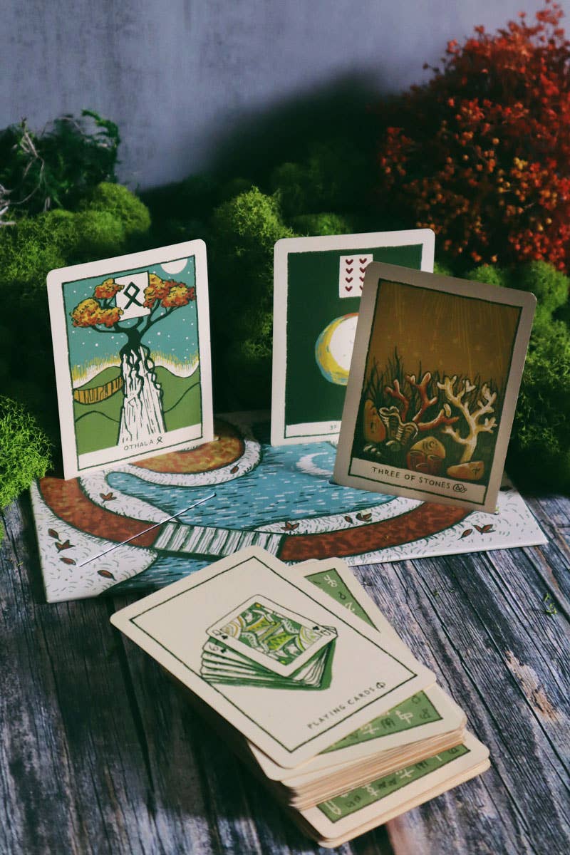 Set of tarot cards on a wooden surface with nature-themed illustrations