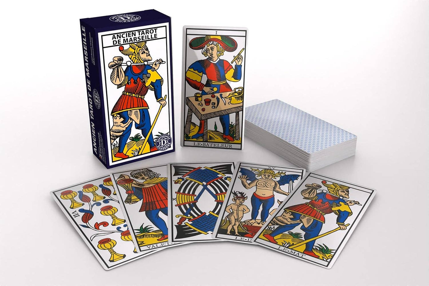 Collection of tarot cards with a deck, box, and cards displayed on a white background