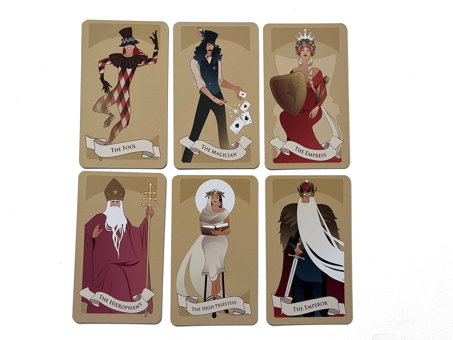 Set of six tarot cards with illustrated figures on a beige background
