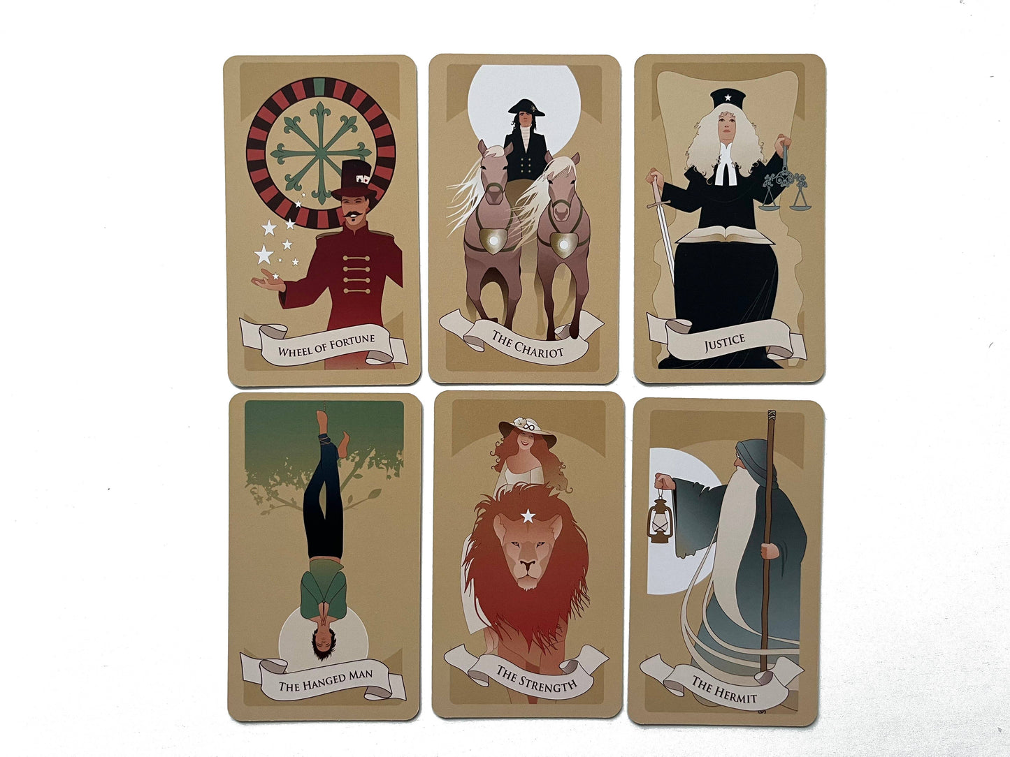 Set of tarot cards with illustrations and text on a beige background
