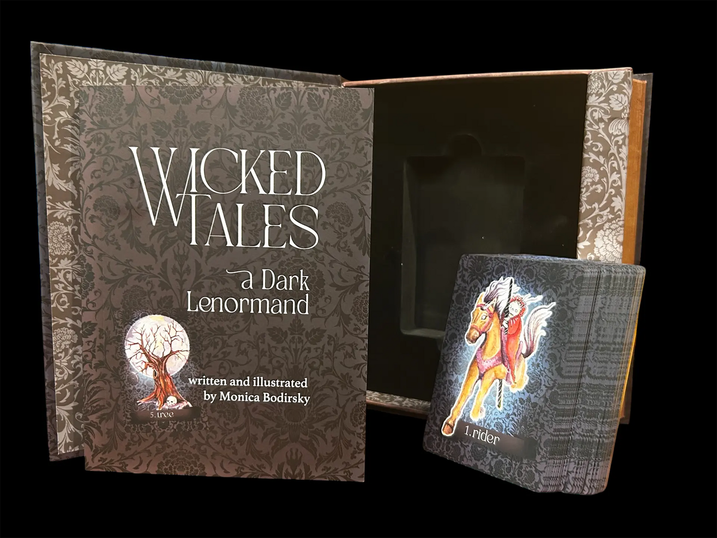 Book titled 'Wicked Tales: A Dark Lenormand' with a tarot card on a black background