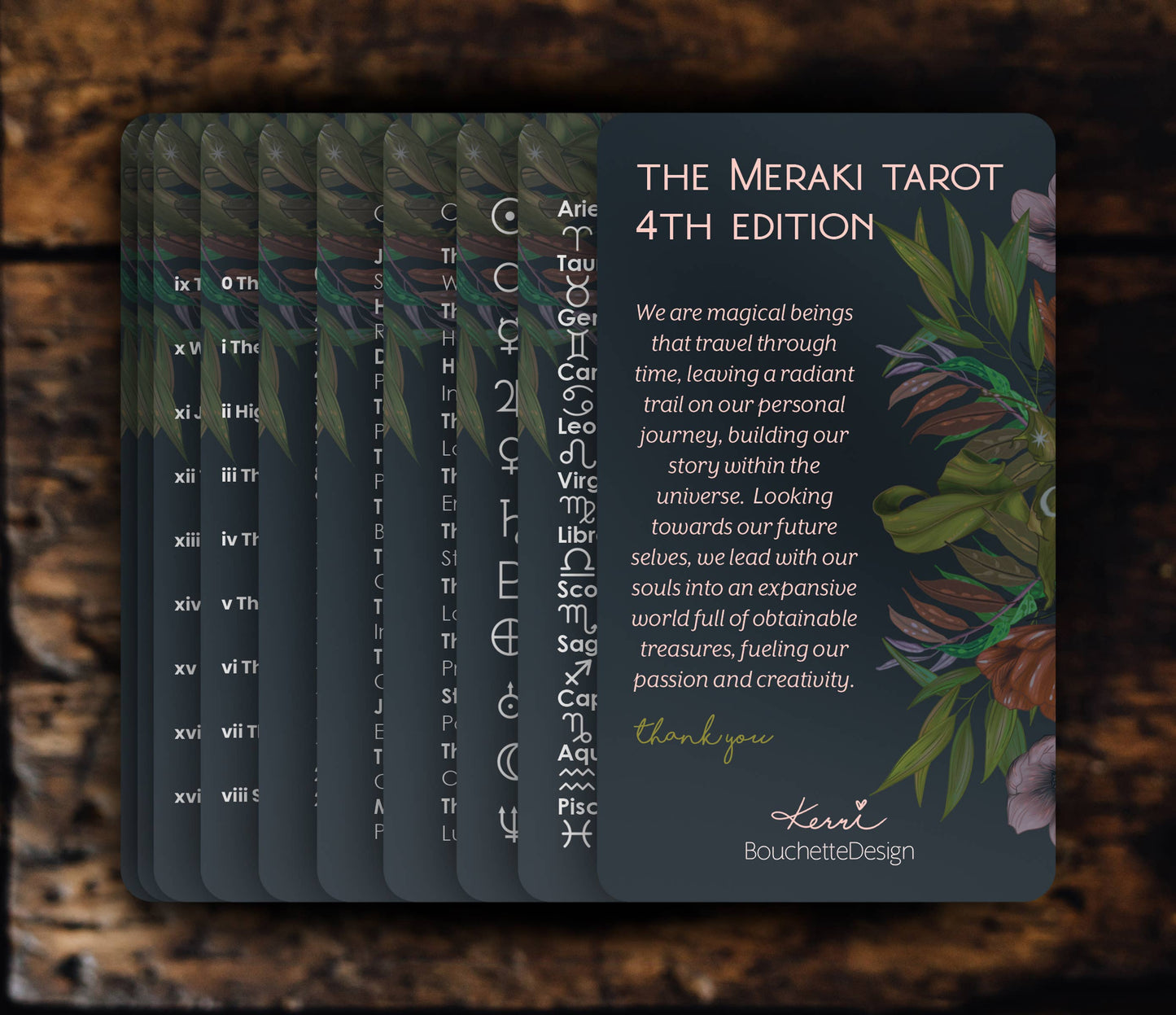 Meraki Tarot cards with astrological symbols and text on a dark background