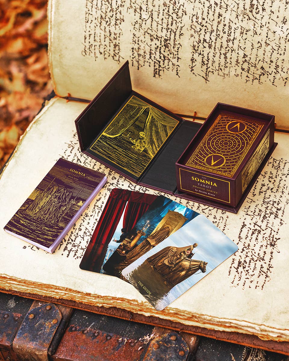 Somnia card deck packaging with cards displayed on an open book