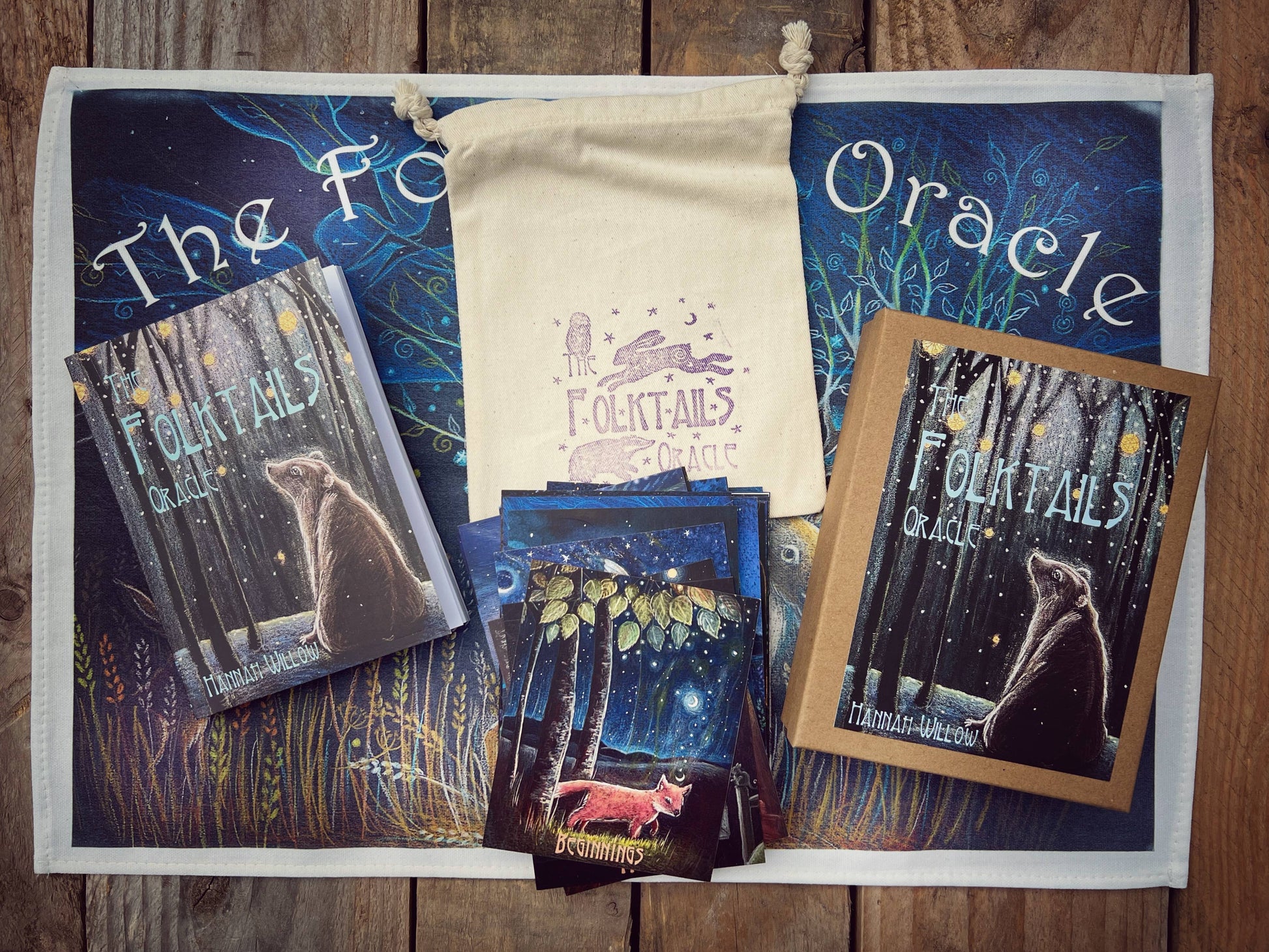Folktale Oracle cards with tarot bags on a wooden surface