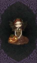 A young demon girl sat on her knees wearing a feather dress accompanied by a jack o lantern pumpkin head