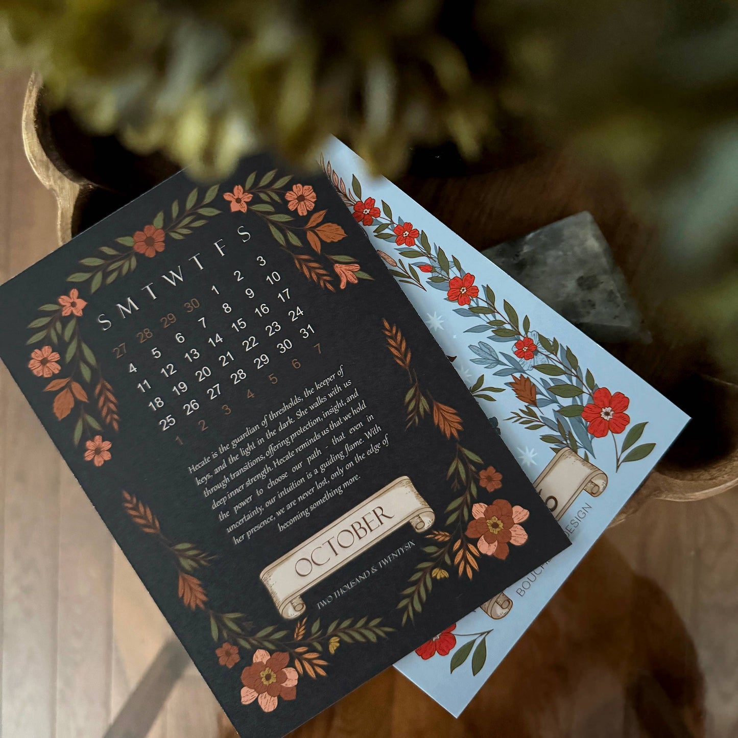 Calendar with floral design on a wooden surface