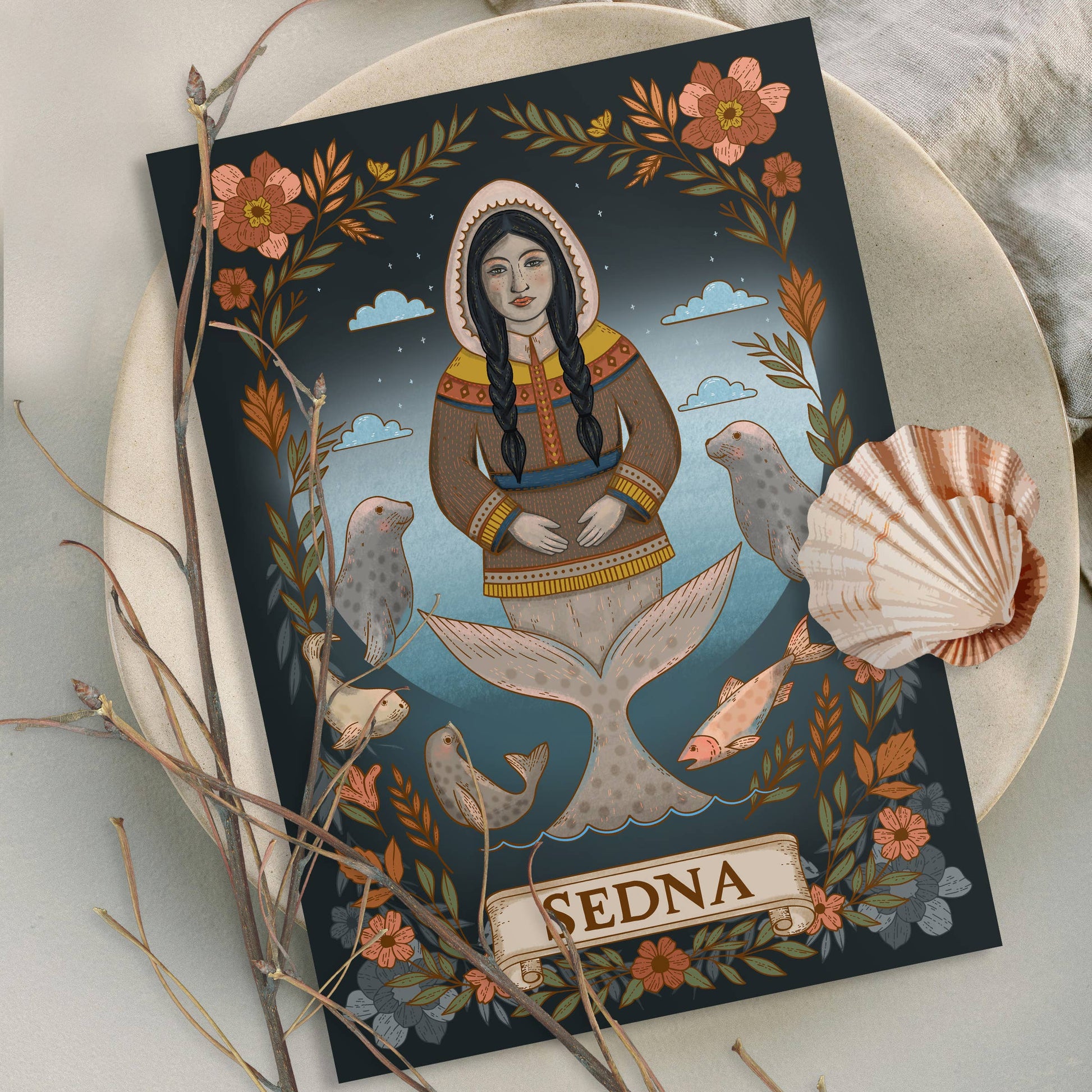 Card featuring an illustration of a mermaid named Sedna with decorative elements on a white surface.