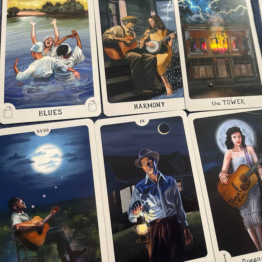 Collection of tarot cards with artistic illustrations of musicians and scenes.