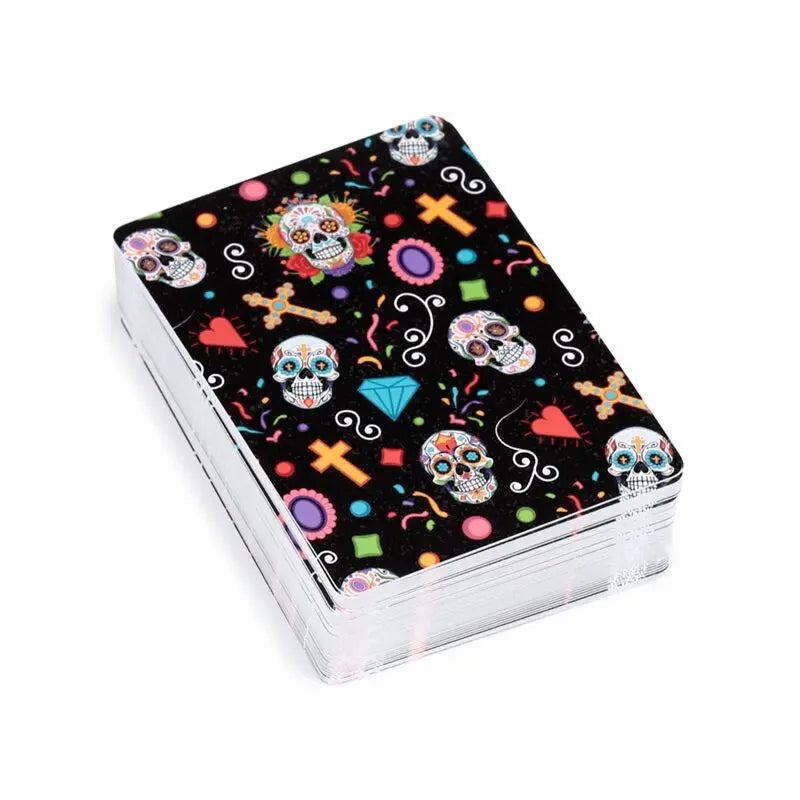 Playing cards with colorful skull design on a black background