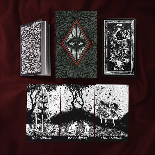 Collection of black and white illustrations and tarot cards on a dark background