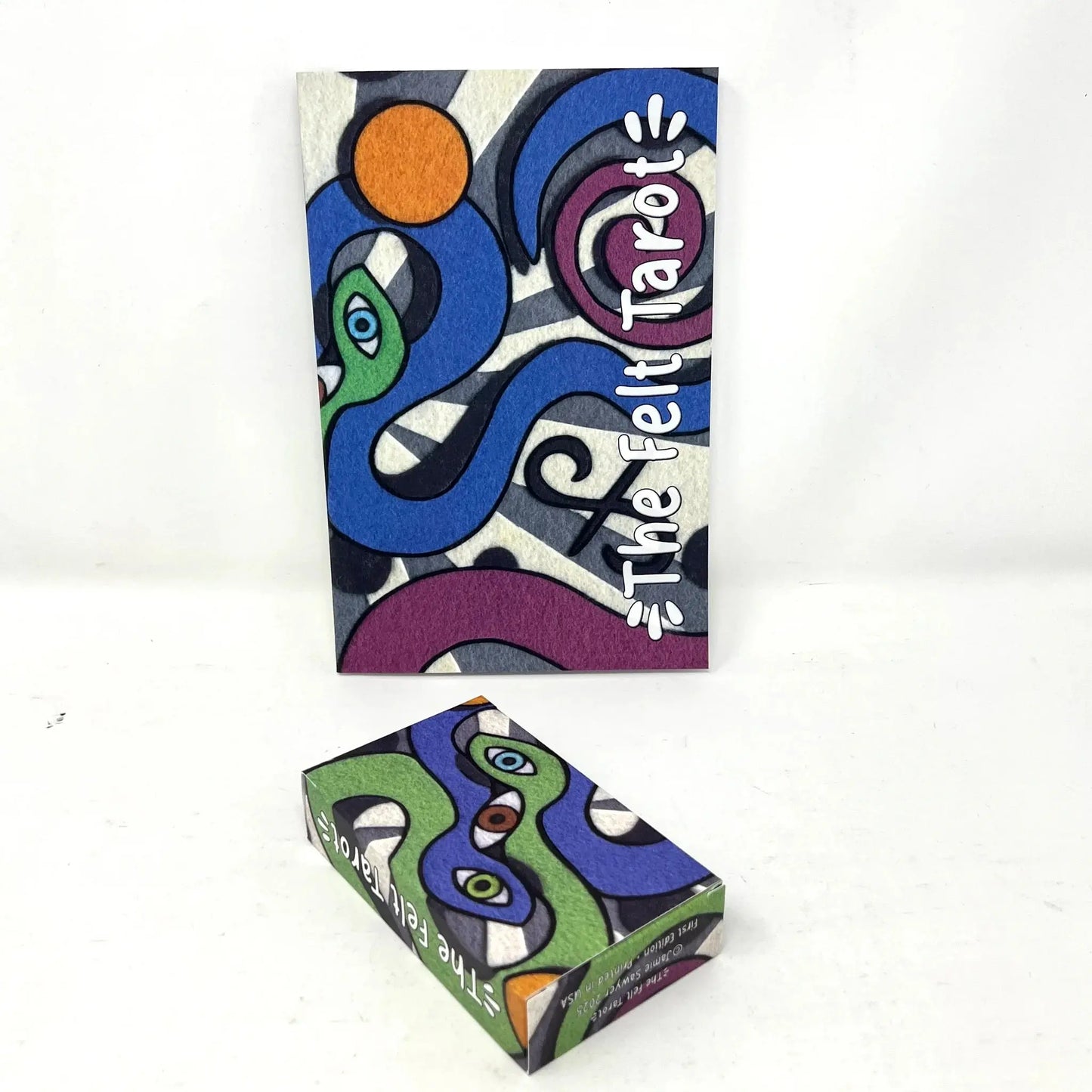 Two colorful boxes with abstract designs and 'The Felt Tarot' text on a white background