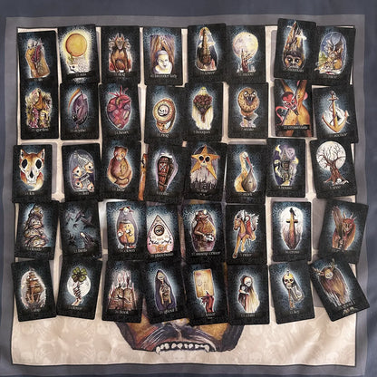 Collection of tarot cards with intricate designs on a textured surface