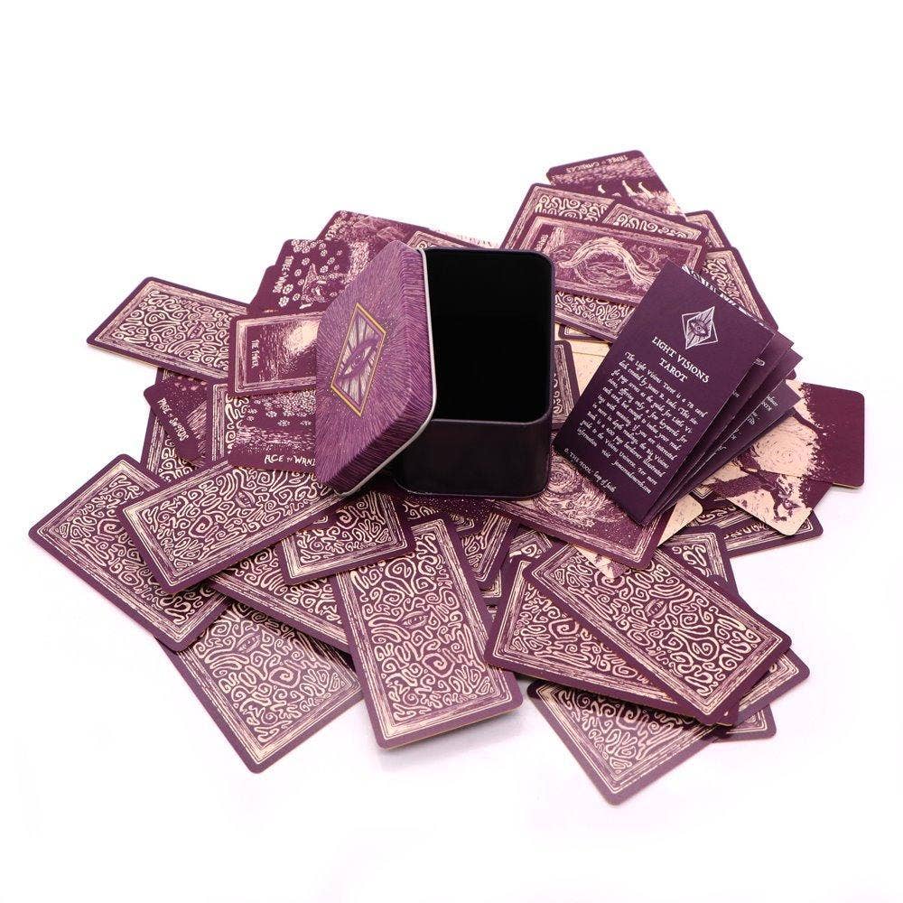 Purple playing cards with intricate designs on a white background