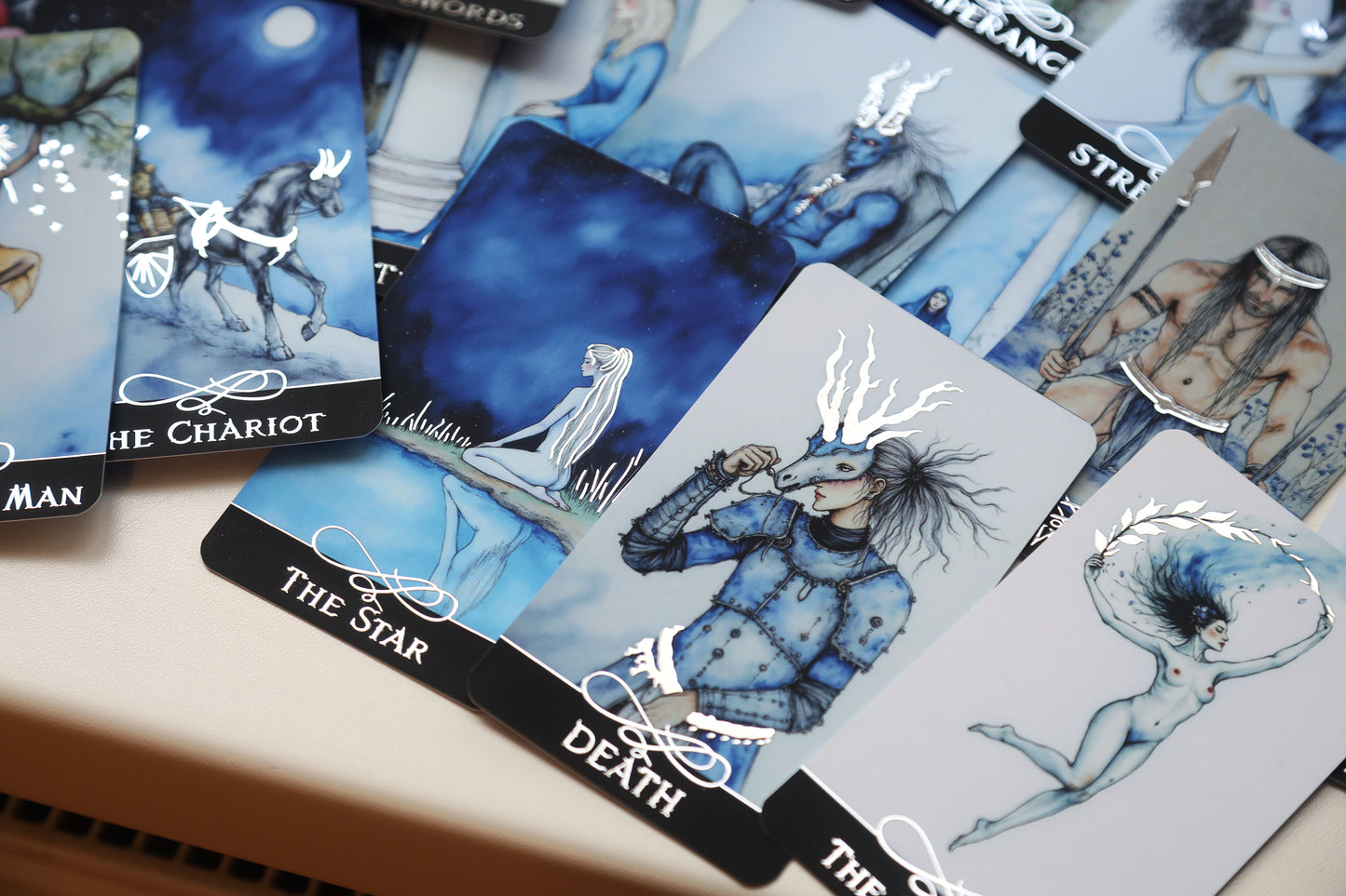 The Blue Tarot UK Exclusive Edition featuring cyanotype-inspired artwork by Kateryna and two exclusive UK alternate cards including The Hermit and The Magician.