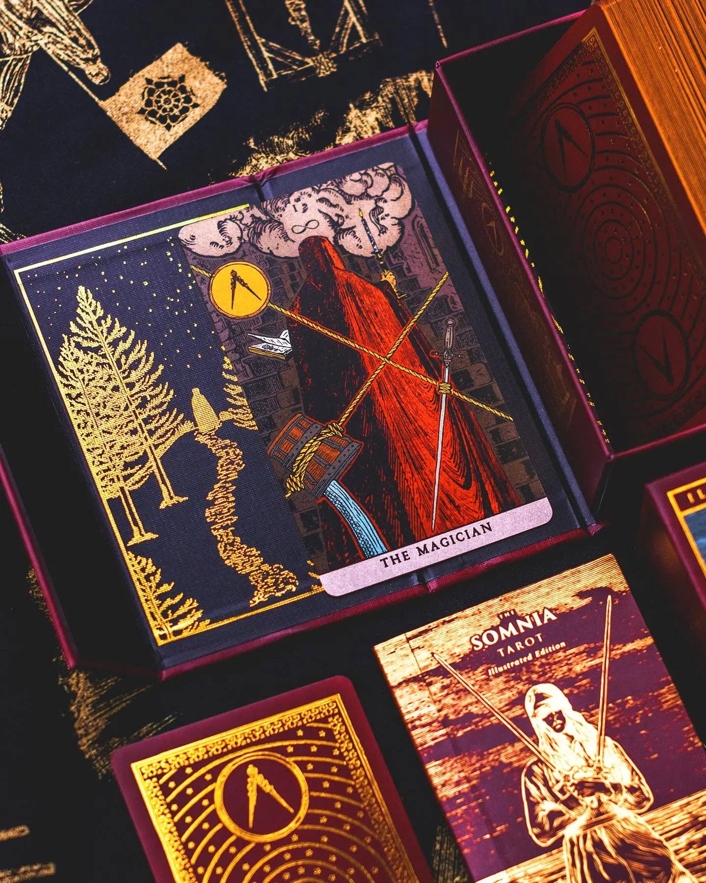 Collection of tarot cards with intricate designs and symbols on a dark background