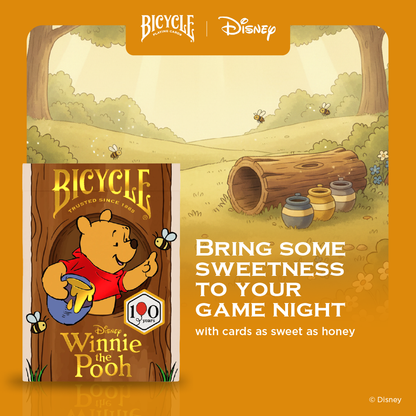 Bicycle card game packaging with Winnie the Pooh design on an orange background