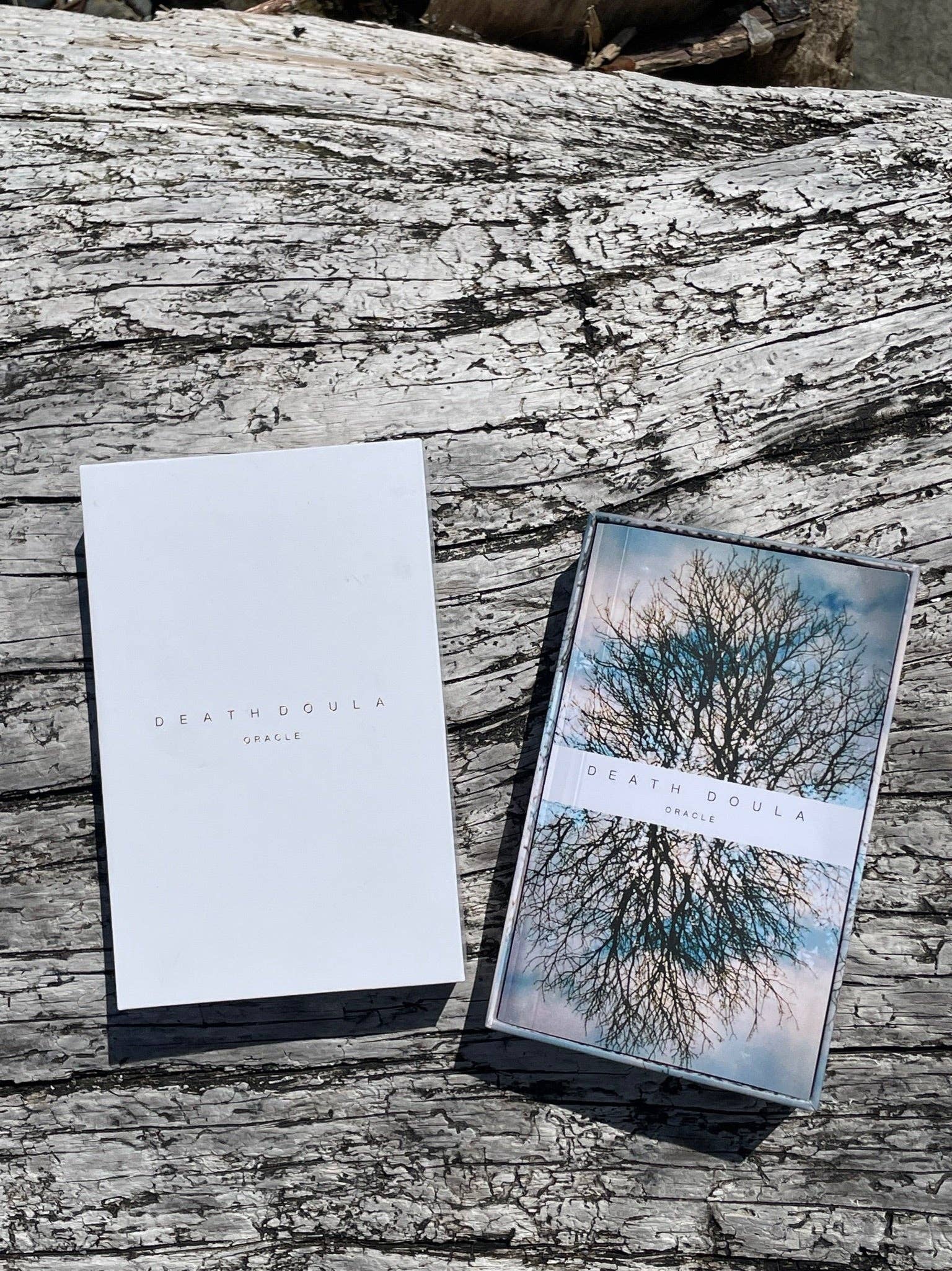 Death Doula Oracle Cards featuring original analogue 35mm photography with double exposure imagery, gold gilded edges and a guidebook for spiritual transformation and healing.