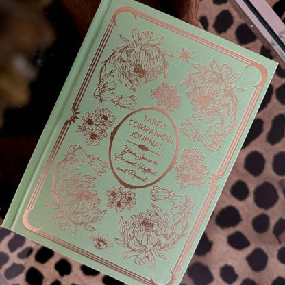 Green tarot companion journal with floral designs on a patterned surface Tarot Journal Bouchette and Co Oneness Emporium