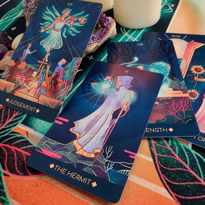 Tarot cards with colorful designs on a textured surface
