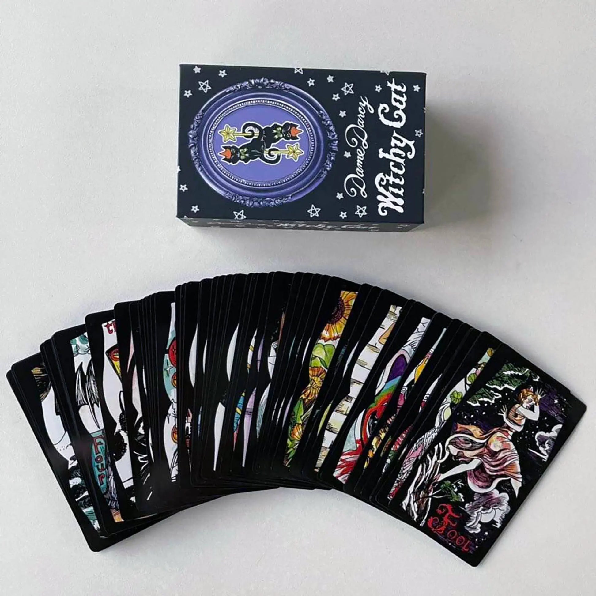 Set of tarot cards with a deck box labeled 'Witchy Cat' on a white background