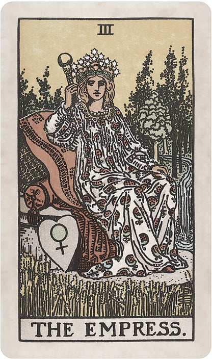 Tarot card featuring 'The Empress' with a woman in a flowing garment and crown, holding a scepter, in a forest setting. Pamela Colman Smith's RWS Tarot Deck Soft Color Edition by U.S. Games Systems featuring muted vintage colours, ivory borders, and the original Rider-Waite-Smith artwork.