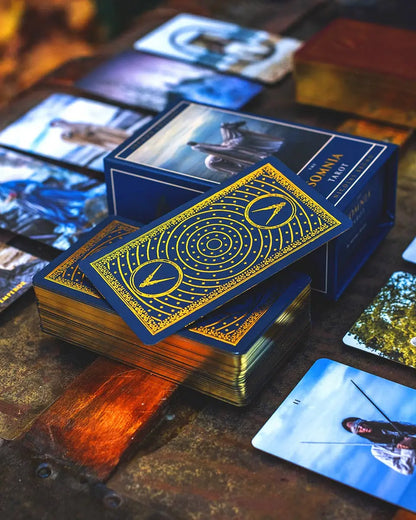 Somnia Tarot Revised Edition by Nicolas Bruno with surreal dream-inspired tarot artwork and gold gilded edges