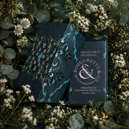 The Meraki Tarot 5th Edition by Kerri Snook featuring whimsical botanical tarot artwork and fantasy-inspired symbolism
