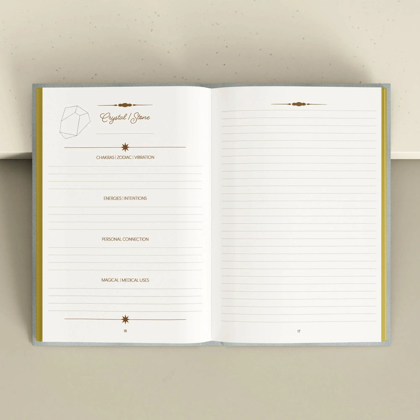 Open notebook with lined pages on a beige background Crystal companion journal by Bouchette and Co available from Oneness Emporium