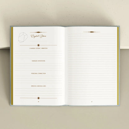 Open notebook with lined pages on a beige background Crystal companion journal by Bouchette and Co available from Oneness Emporium