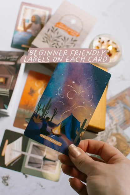 Hand holding a tarot card with other cards in the background, text overlay 'Beginner Friendly Labels on Each Card'.