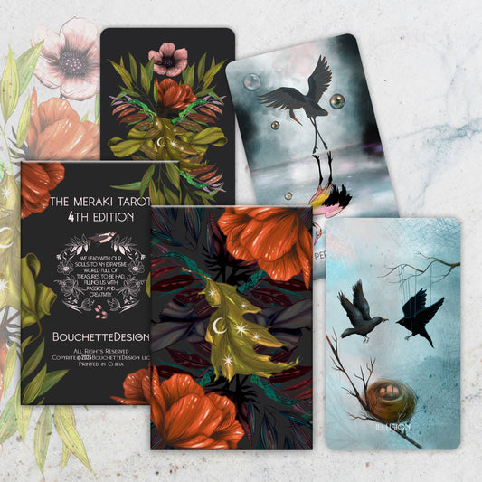 Collection of tarot cards with artistic designs on a marble surface