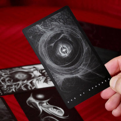 Black Tarot deck with minimalist black and white design and 78 tarot cards