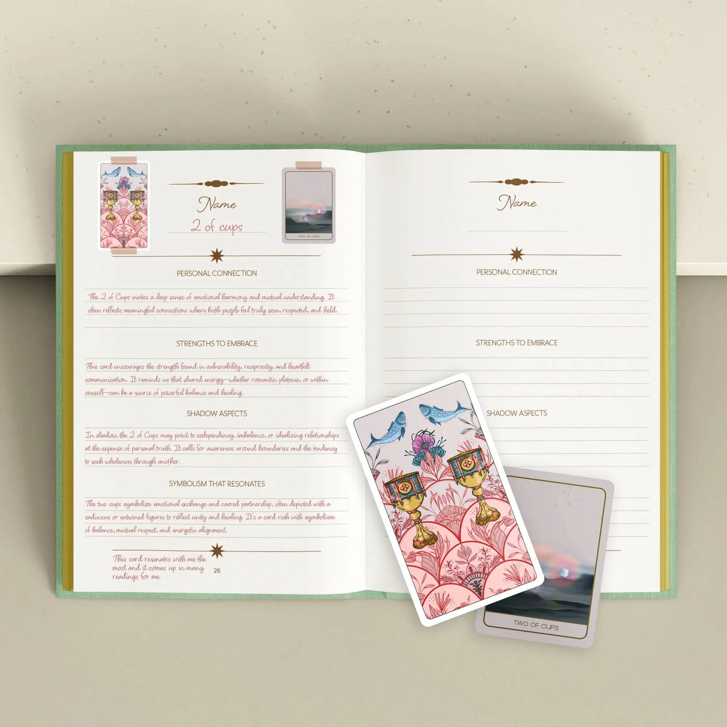 Open book with tarot cards on a light background Tarot Journal Bouchette and Co Oneness Emporium