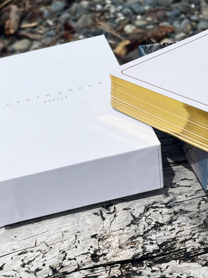 Death Doula Oracle Cards featuring original analogue 35mm photography with double exposure imagery, gold gilded edges and a guidebook for spiritual transformation and healing.