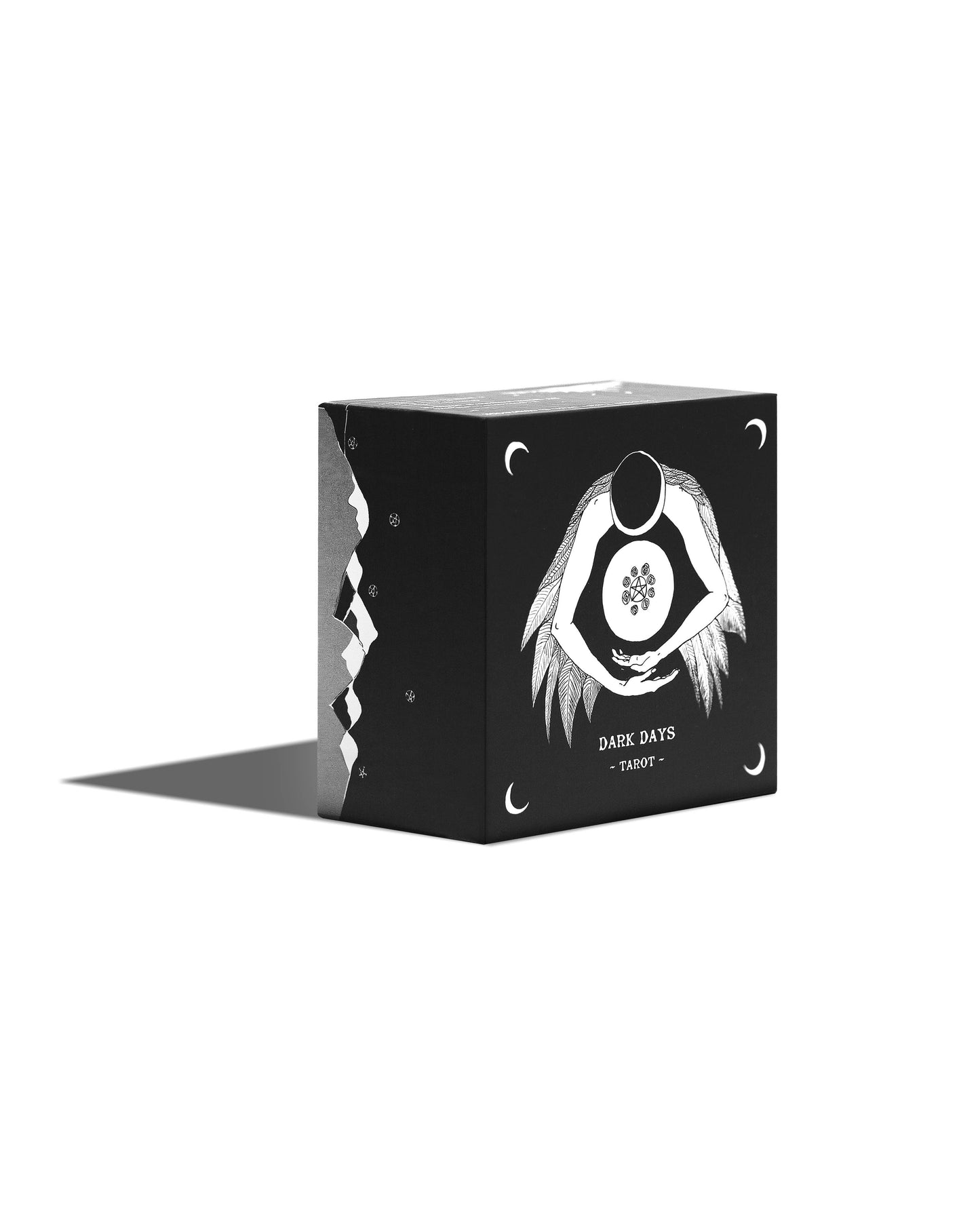 Black box with white design and text on a white background Dark Days Tarot by Wren McMurdo Brignac featuring square black-and-white tarot cards inspired by the lunar cycle with a 180-page guidebook and collector's box.