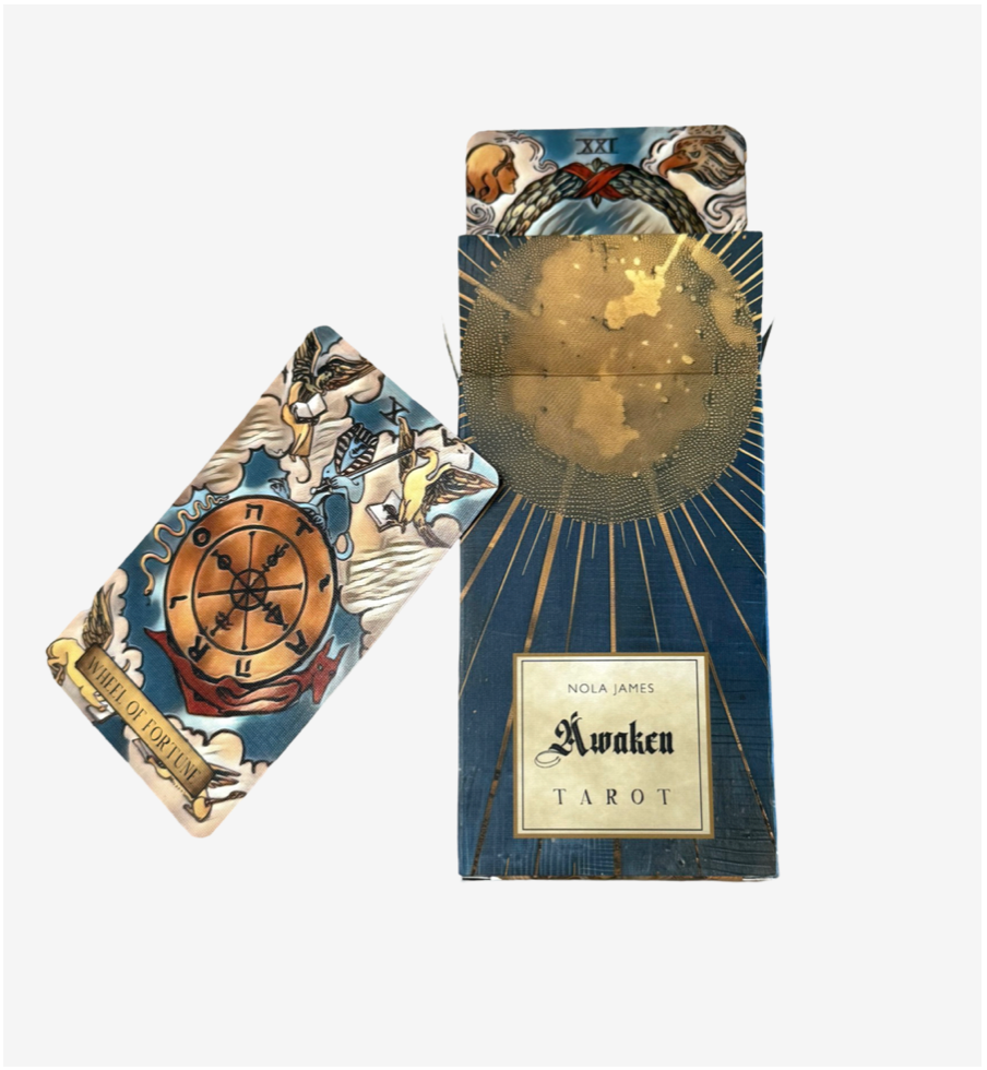 Awaken Tarot indie deck featuring 78 borderless Rider-Waite-Smith inspired tarot cards with embossed linen finish and luxurious gold foil edges.