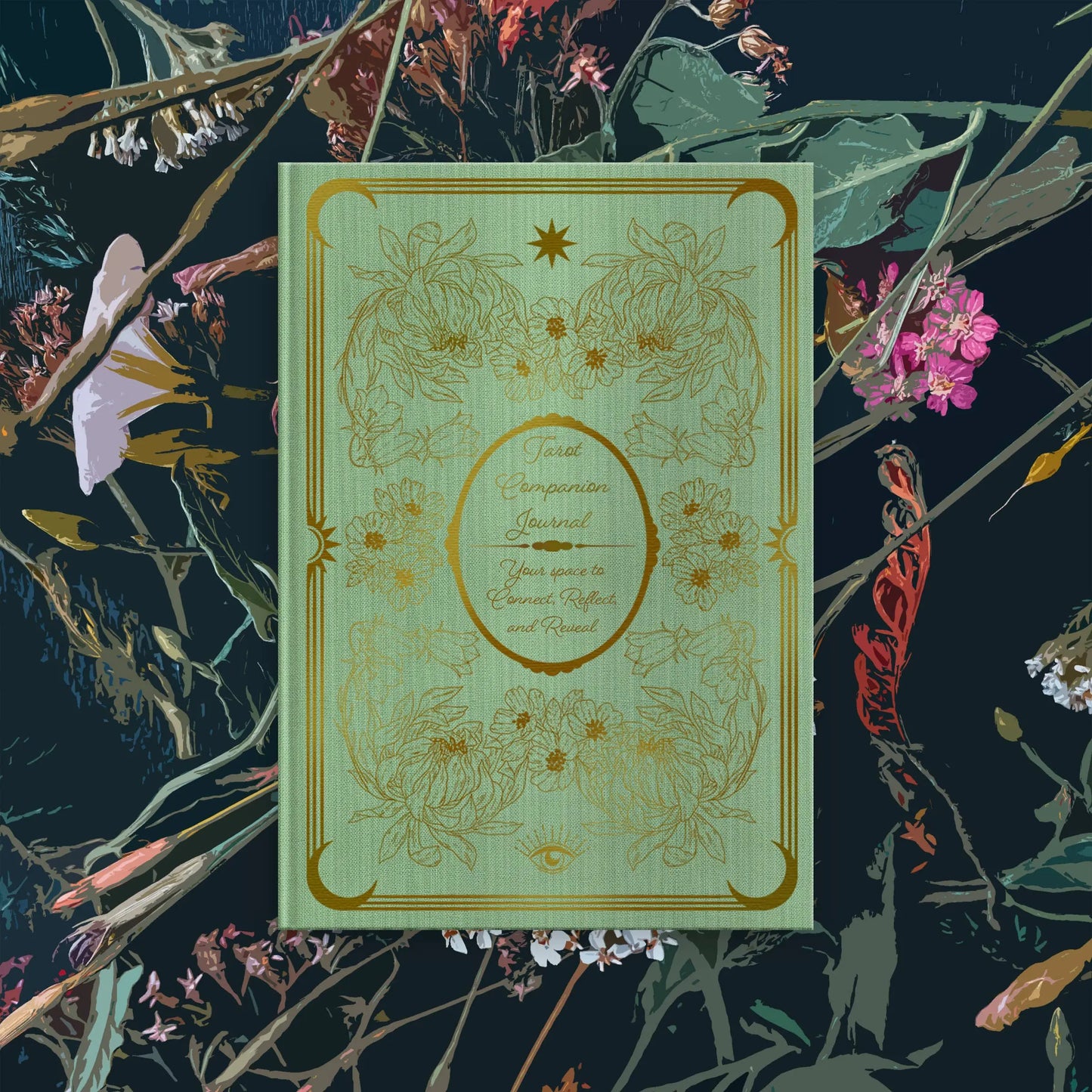 Decorative green tarot  journal with gold floral patterns on a dark background with flowers Bouchette and Co Oneness Emporium 