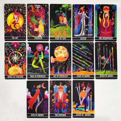 Set of colorful tarot cards with various symbols and designs on a white background
