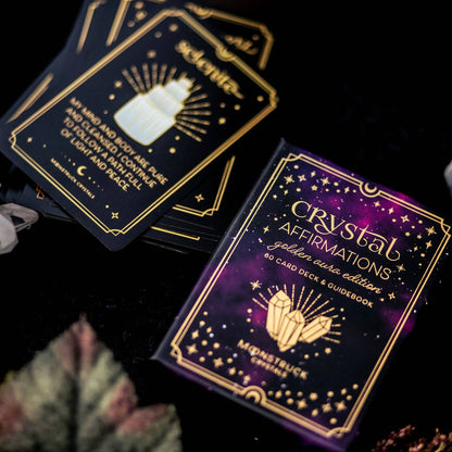 Crystal Affirmations card deck with purple and gold design on a dark background Gold Crystal Affirmations Golden Aura Edition featuring luxury affirmation cards inspired by crystal wisdom, mindfulness, and positive daily intentions.