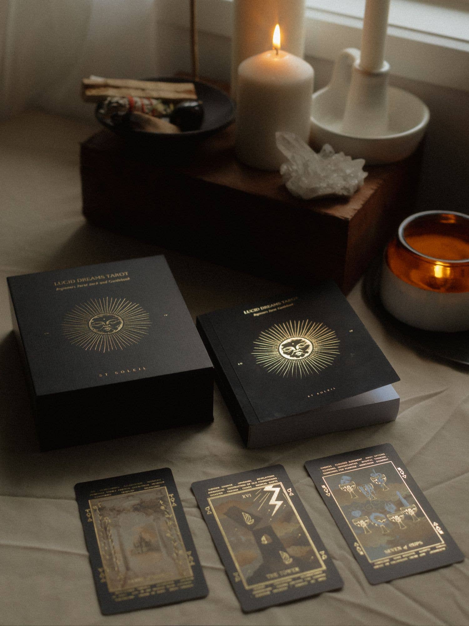Lucid Dreams Beginner's Tarot Black Eclipse Edition IV by ST. SOLEIL featuring matte black cards with gold foil details, premium linen finish and magnetic keepsake box.
