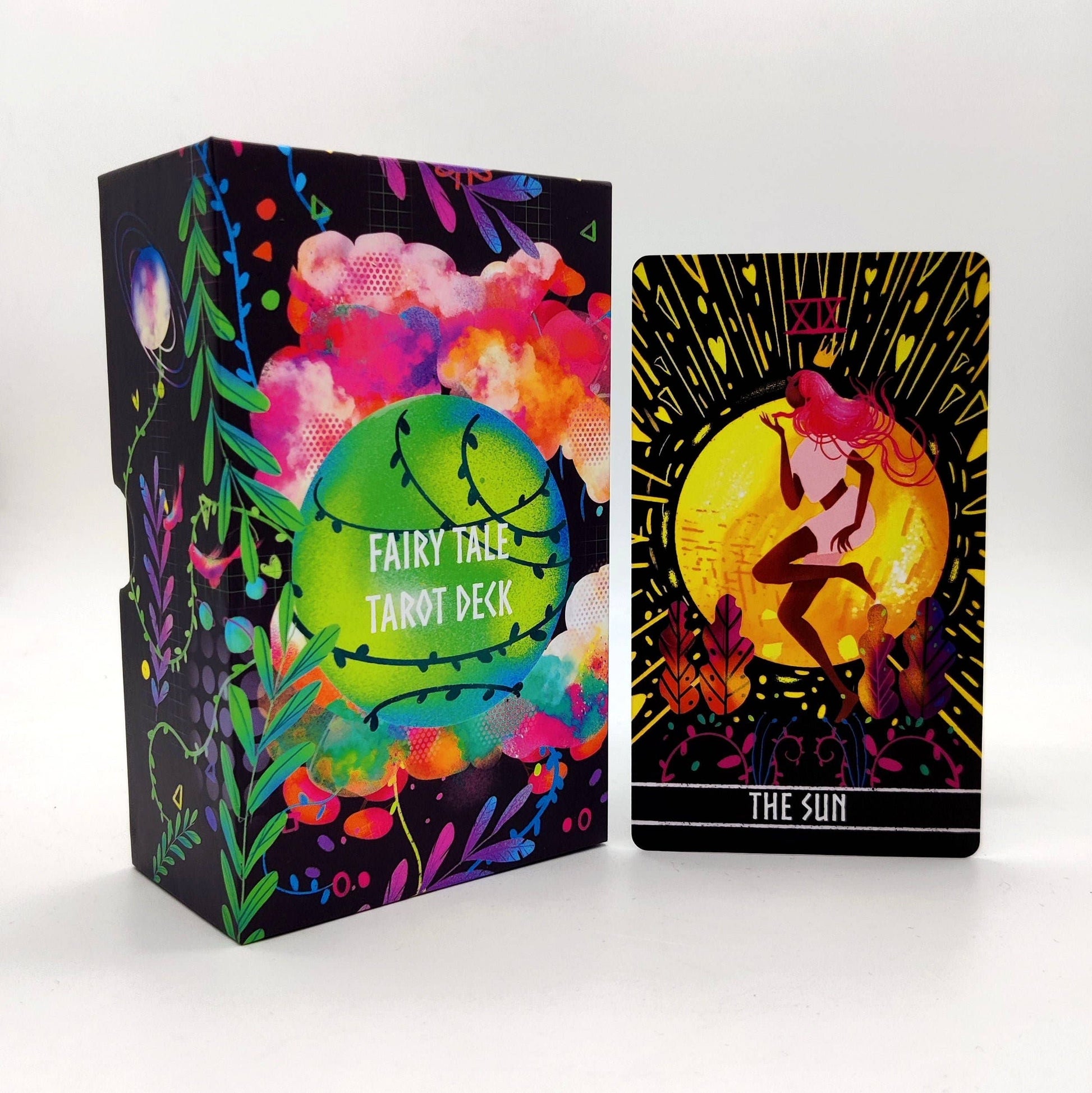 Fairy Tale Tarot Deck packaging with a tarot card featuring 'The Sun' illustration on a white background.
