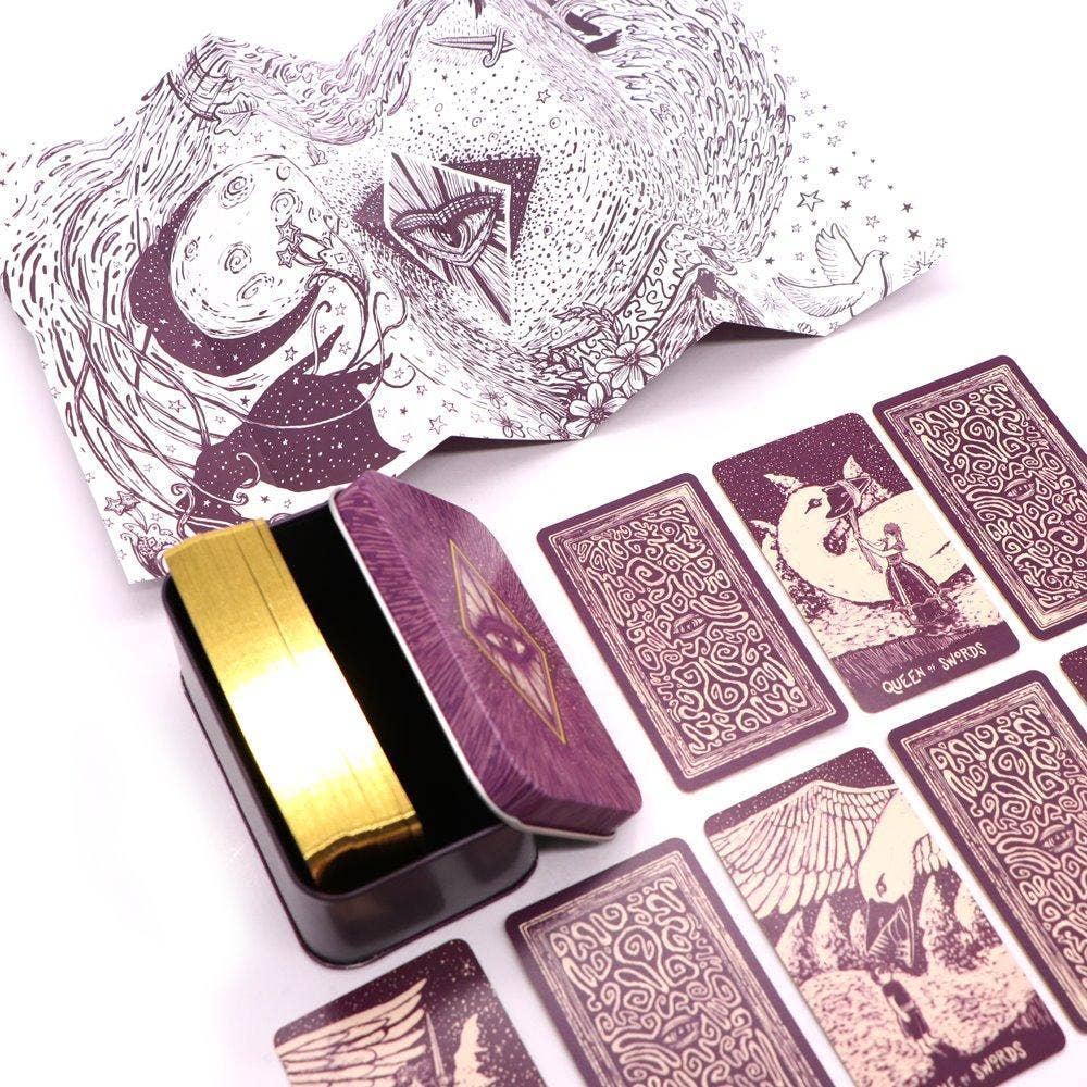 Purple tarot cards with intricate designs on a white background