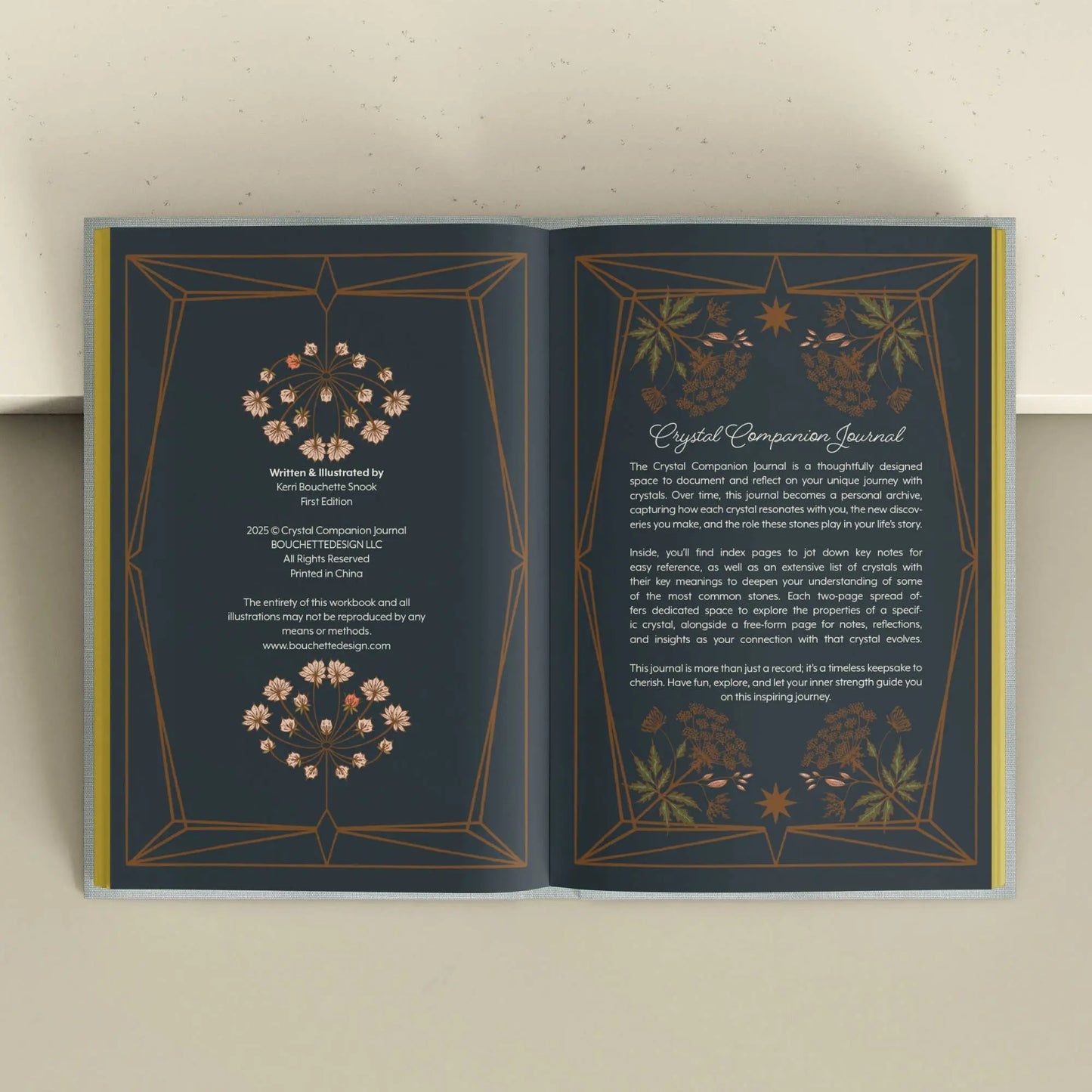 Open book with decorative pages on a light background Crystal companion journal by Bouchette and Co available from Oneness Emporium