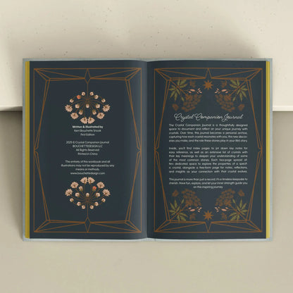 Open book with decorative pages on a light background Crystal companion journal by Bouchette and Co available from Oneness Emporium