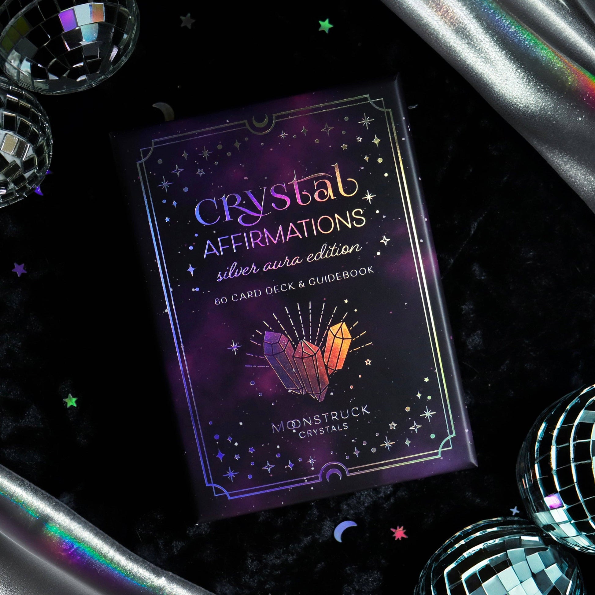 Crystal Affirmations card deck on a dark background with decorative elements