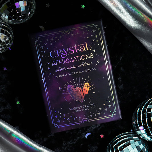 Crystal Affirmations card deck on a dark background with decorative elements