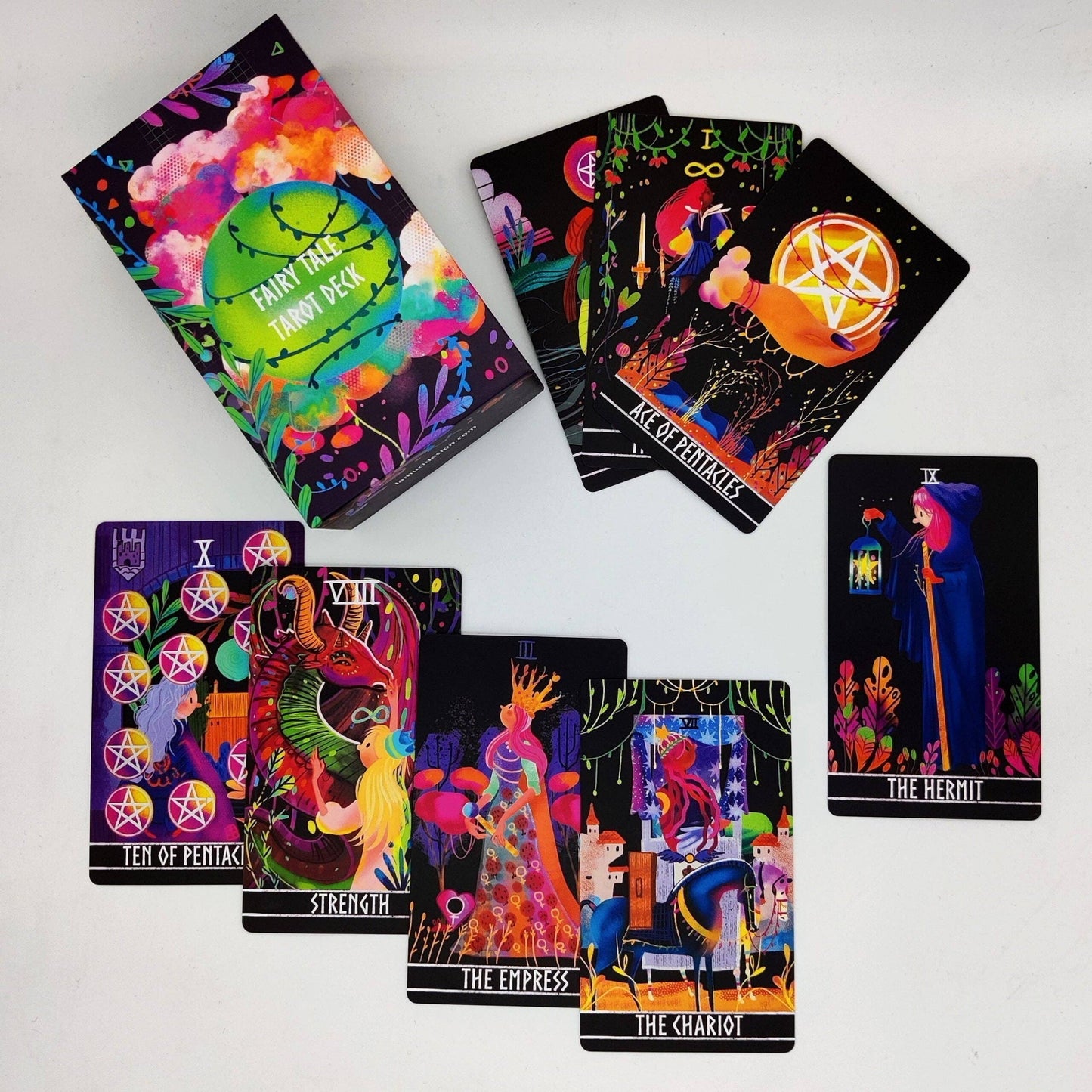 Colorful tarot cards with various designs on a white background