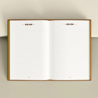 Open notebook with lined pages and decorative arrows on a plain background Grimoire Bouchette and Co Oneness Emporium