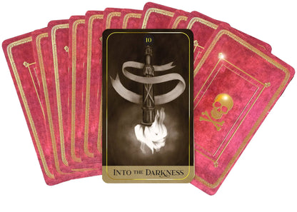 Set of tarot cards with a central card featuring a skull and crossbones design.